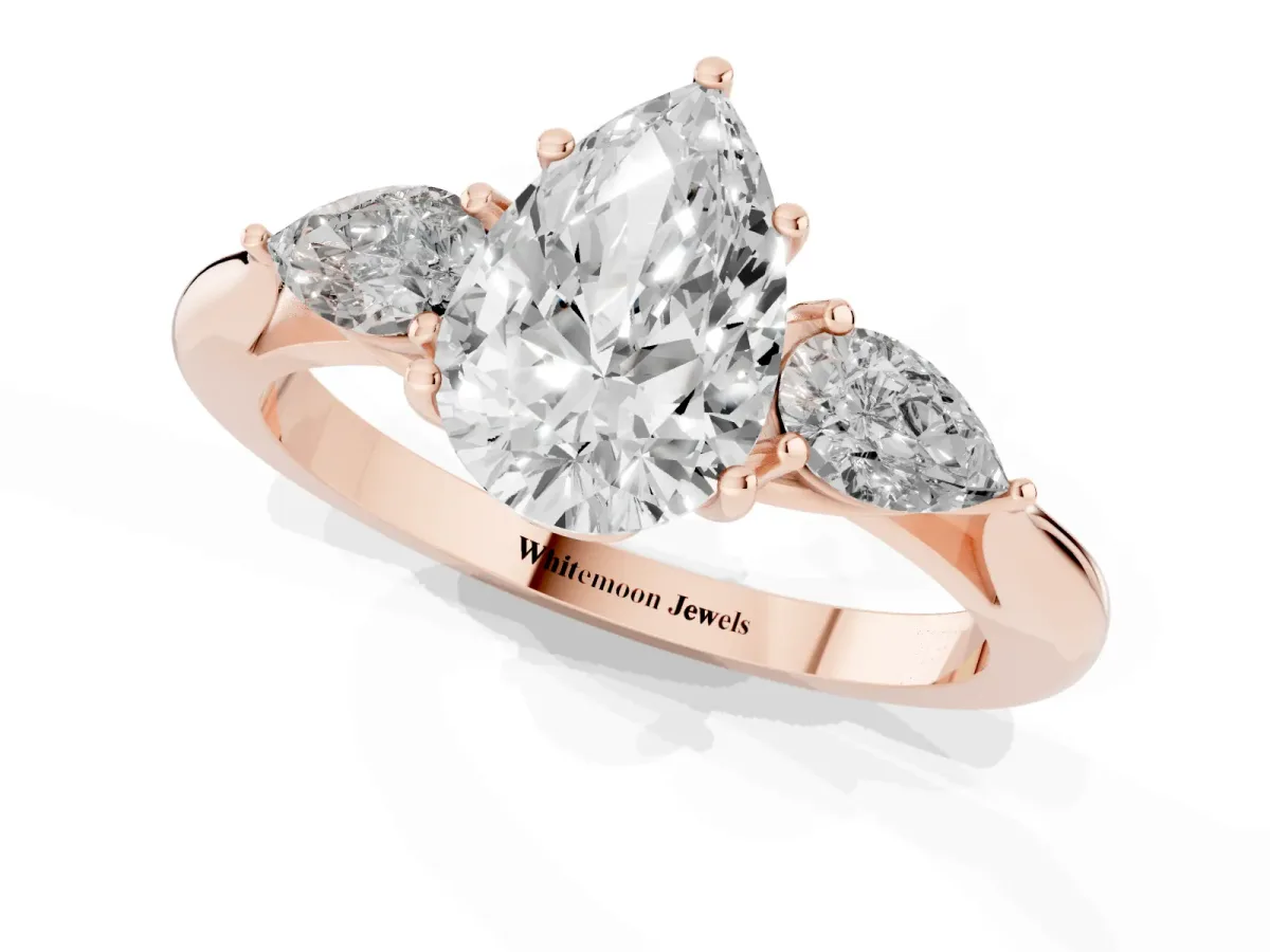 Three-Stone Pear Cut Brilliant Diamond Solitaire Ring with Tapered Band and Four-Prong Setting Rose gold