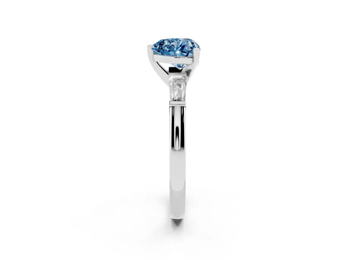 Fancy Blue Heart Cut Solitaire with Tapered Baguette Side Stones on a Classic Band with Four-Prong Setting White gold