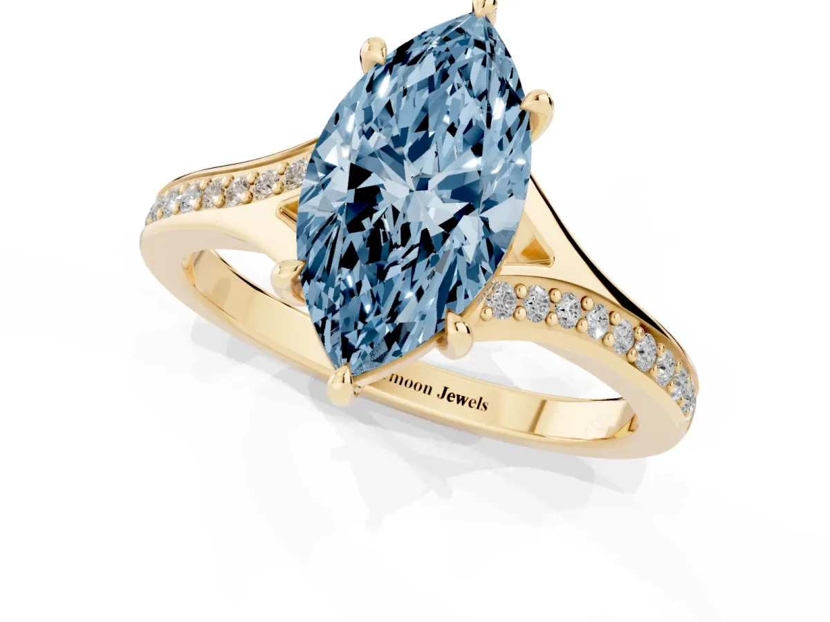 Fancy Blue Marquise Cut Diamond Solitaire Ring with Pavé Band and Prong Setting Yellow gold