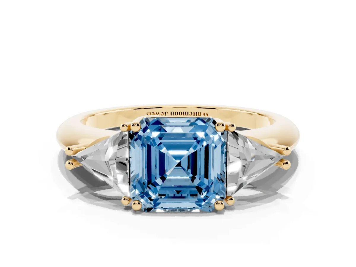 Fancy Blue Three-Stone Asscher Cut Diamond Engagement Ring with Trillion Side Stones and Prong Setting Yellow gold