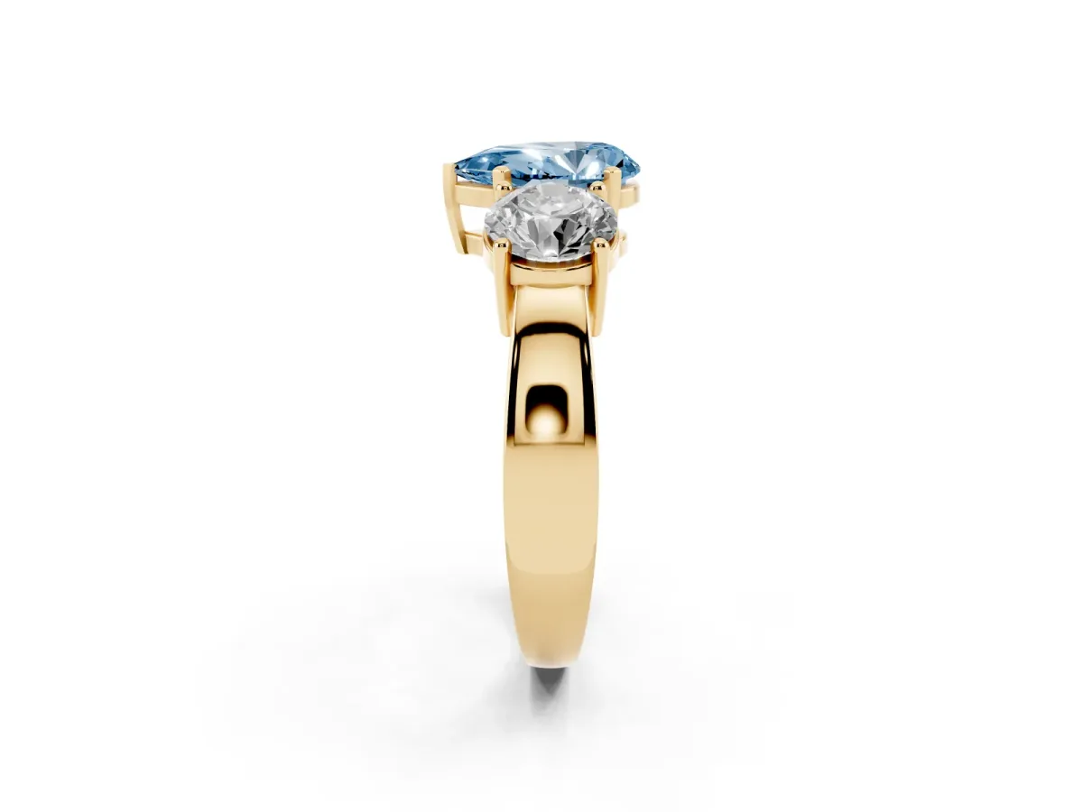 Fancy Blue Three-Stone Pear Cut Diamond Ring with Round Side Stones, Classic Band, and Four-Prong Setting Yellow gold