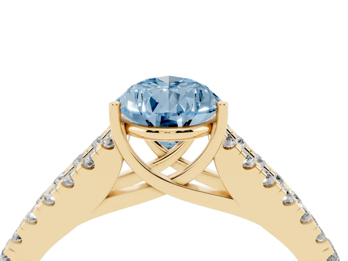 Fancy Blue Pear Cut Diamond Split Shank Engagement Ring with Round Pavé and Prong Setting Yellow gold