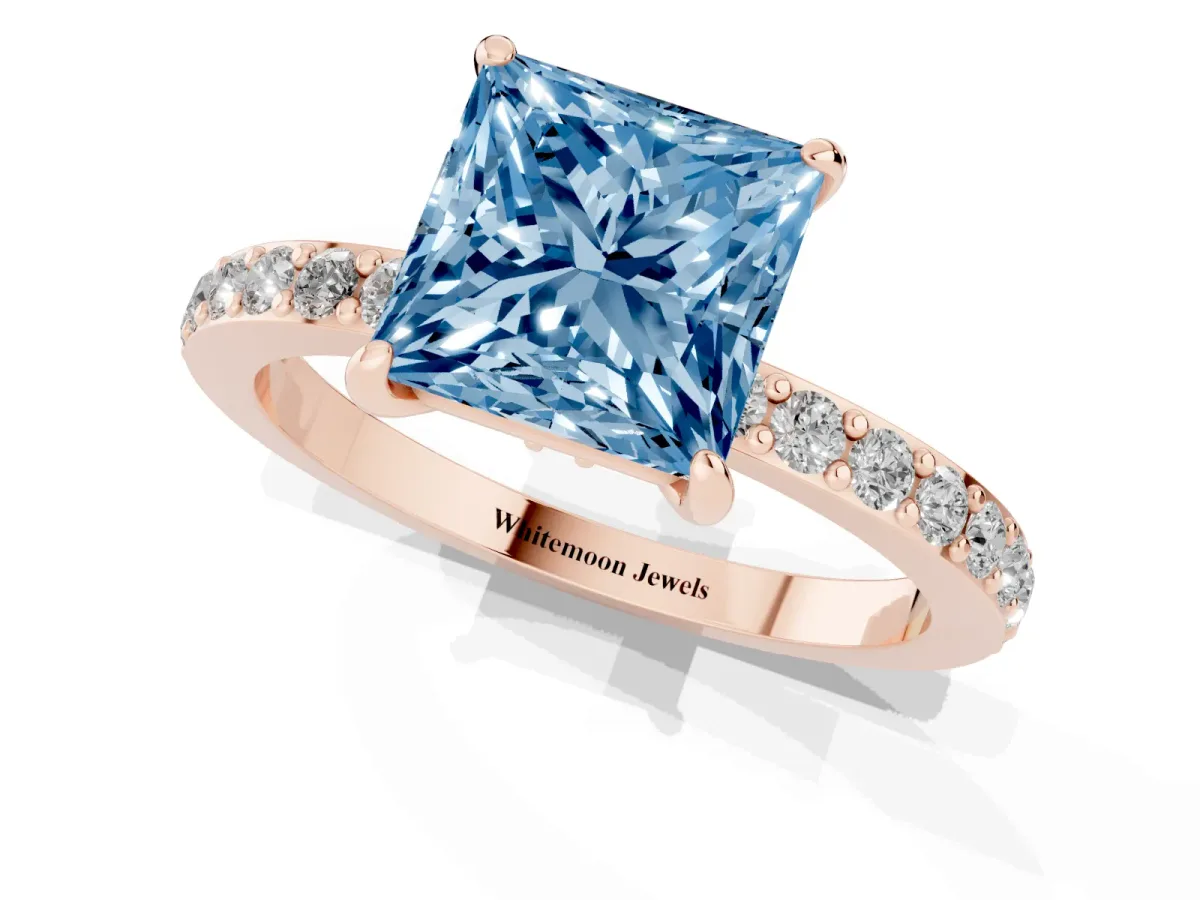 Fancy Blue Princess Cut Diamond Pavé Engagement Ring with Round Accents and Prong Setting Rose gold