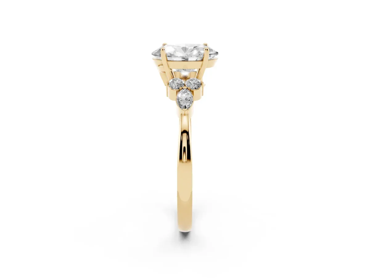 Oval Cut Brilliant Diamond Solitaire Ring with Pear Side Stones and Four-Prong Setting Yellow gold