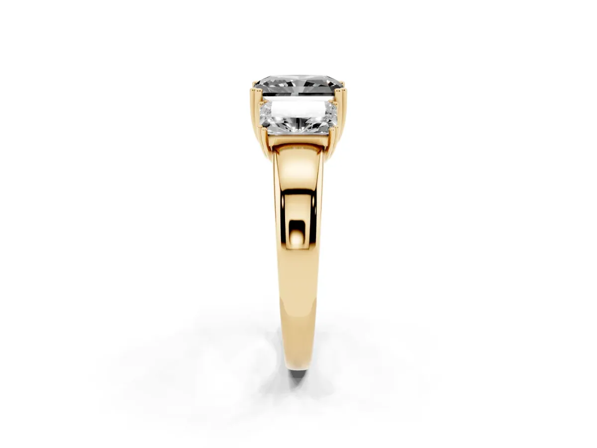 Fancy Black Three-Stone Radiant Cut Cut Diamond Ring with Channel Set Band and Four-Prong Setting Yellow gold