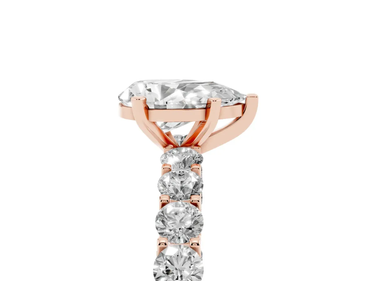 Pear Cut Diamond Solitaire Ring with Shared Prong Pavé Band and Four-Prong Setting Rose gold