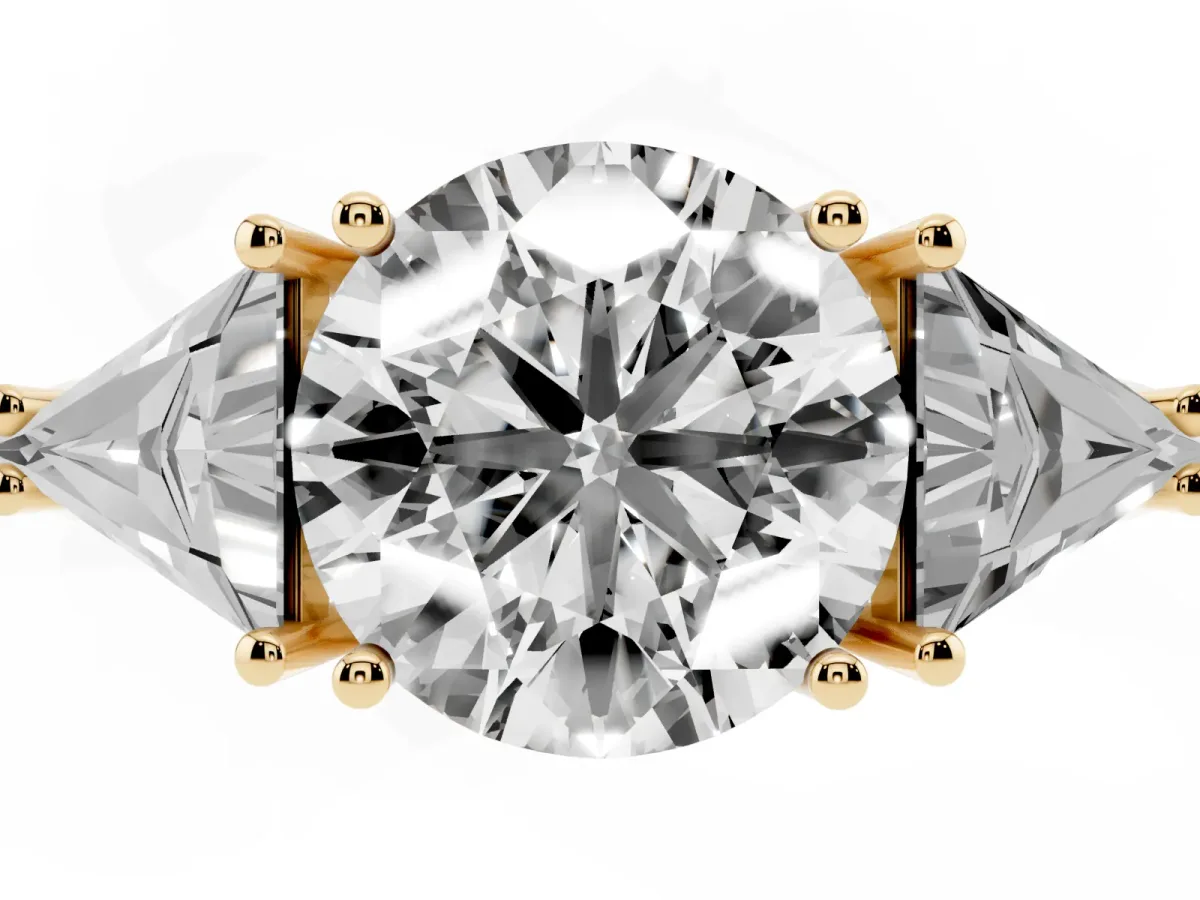 Three-Stone Round Cut Diamond Engagement Ring with Trillion Side Stones and Prong Setting Yellow gold