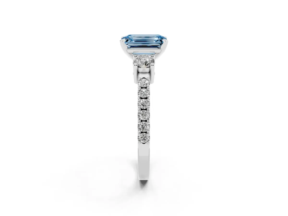 Fancy Blue Emerald Cut Three-Stone Diamond Pavé Band with Prong Setting Platinum
