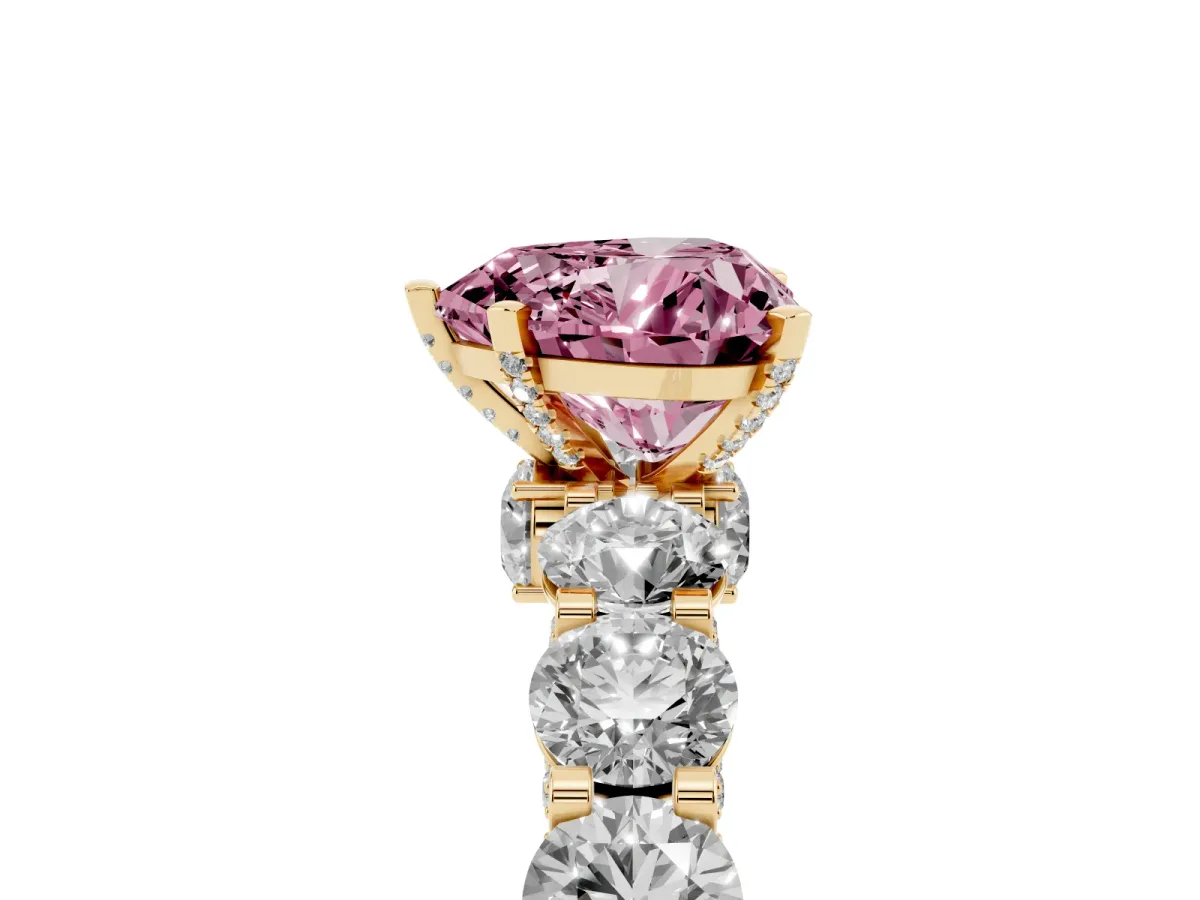 Fancy Pink Heart Cut Diamond Side Stone Engagement Ring with Four-Prong Setting Yellow gold