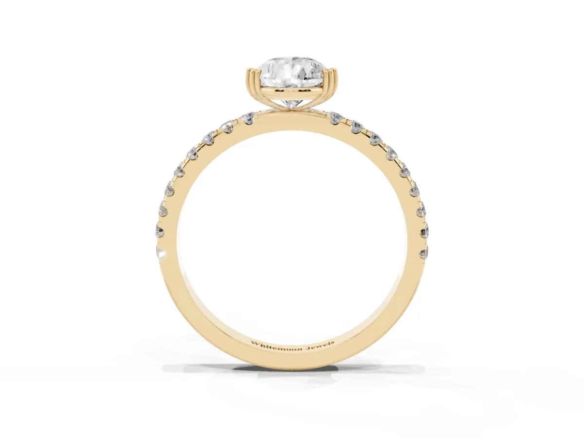 Pear Cut Brilliant Solitaire with Pavé Band and Claw Prong Setting Yellow gold