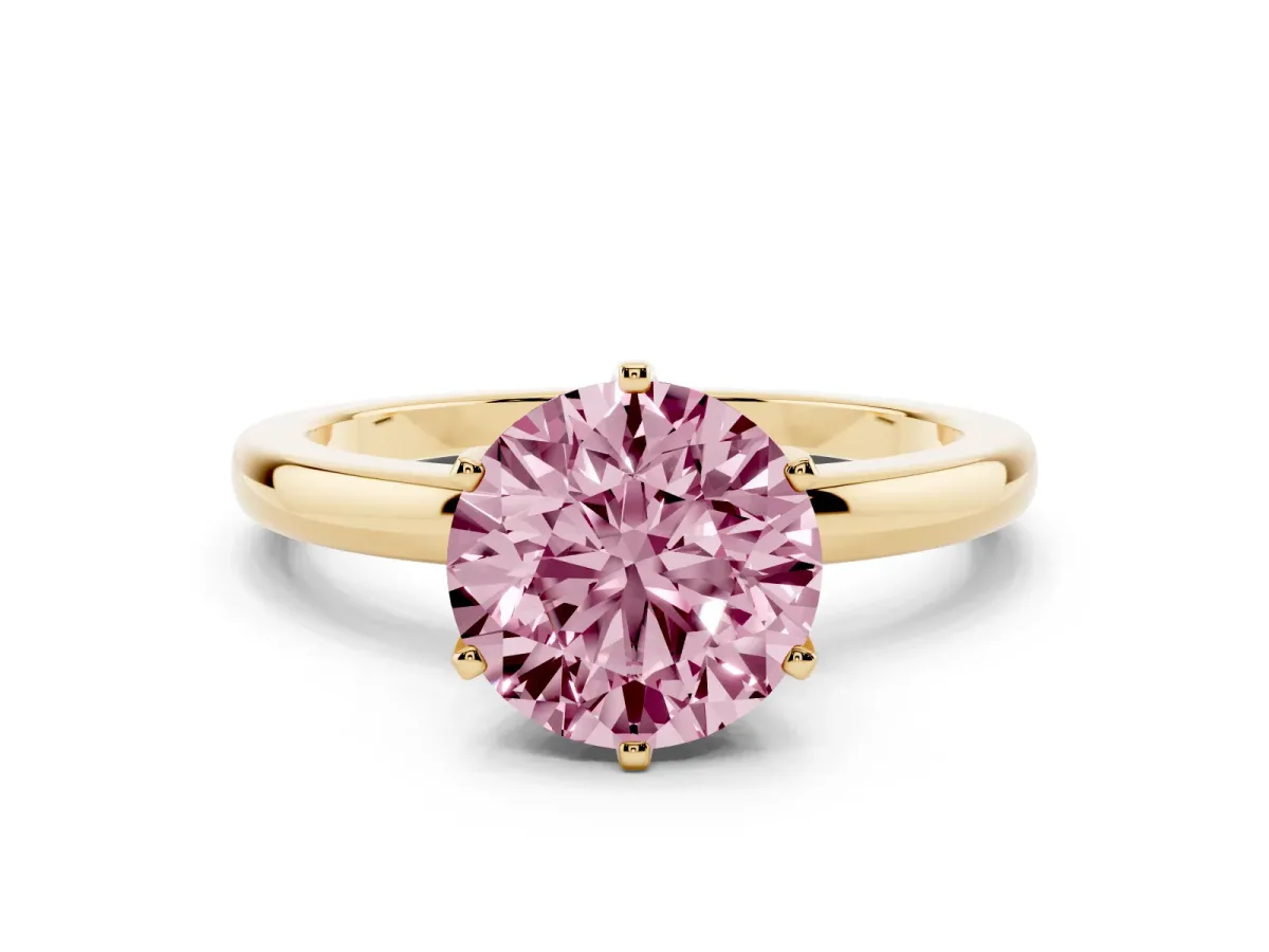 Fancy Pink Round Cut Solitaire Diamond Ring with Six-Prong Setting on a Classic Band Yellow gold