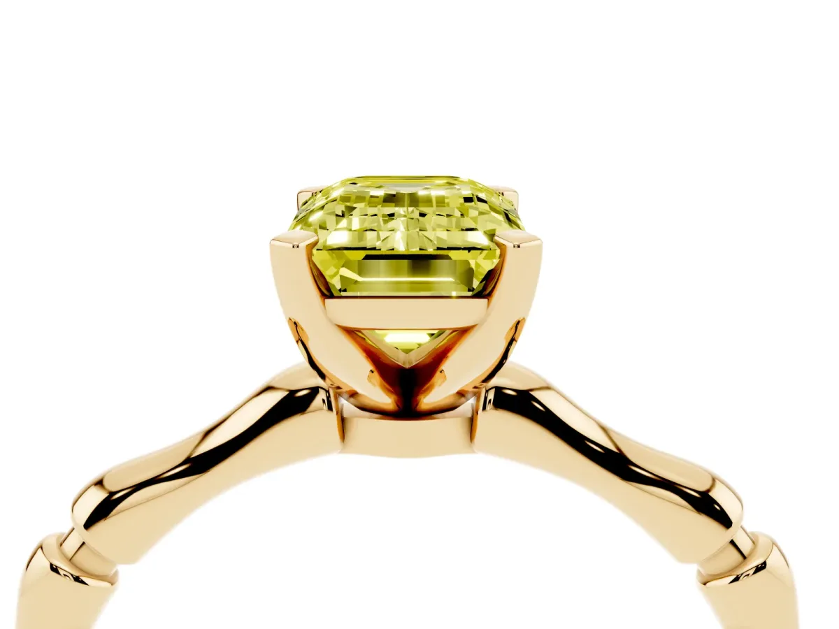 Fancy Yellow Emerald Cut Solitaire Diamond Ring with Bamboo Band and Four-Prong Setting Yellow gold