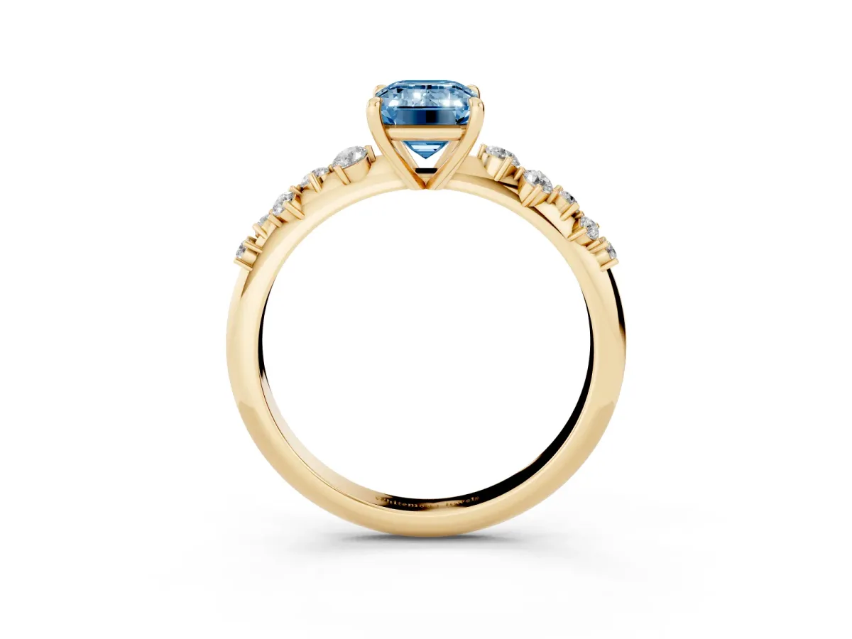 Fancy Blue Emerald Cut Diamond Cluster Side Stone Solitaire Ring with Prong Setting Yellow gold