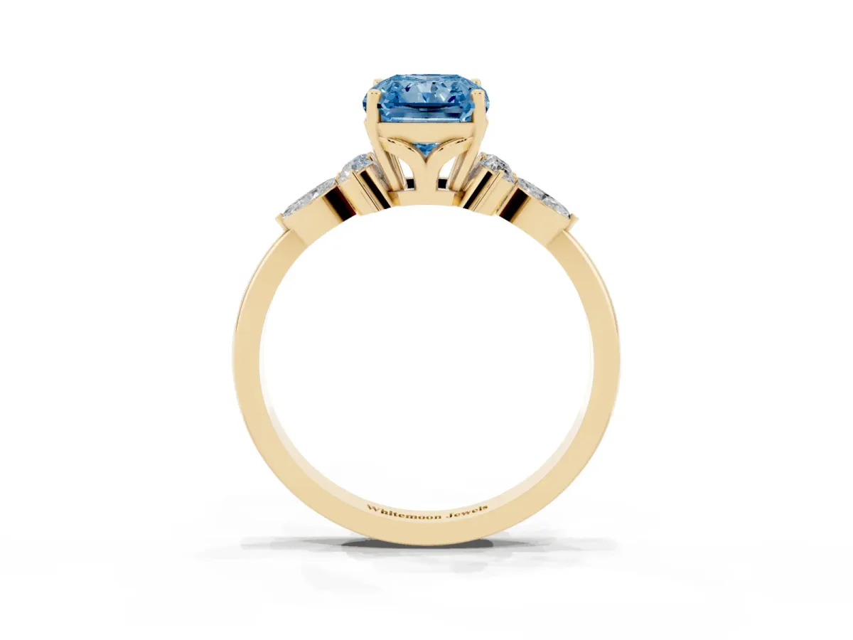 Fancy Blue Radiant Cut Brilliant Diamond Solitaire Ring with Pear Side Stones and Four-Prong Setting Yellow gold