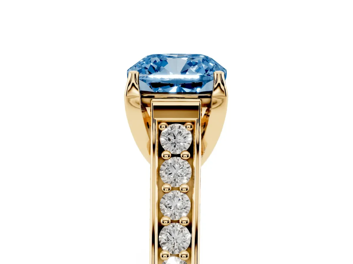 Fancy Blue Cushion Cut Brilliant Cut Diamond Engagement Ring with Pavé Band and Four-Prong Setting Yellow gold