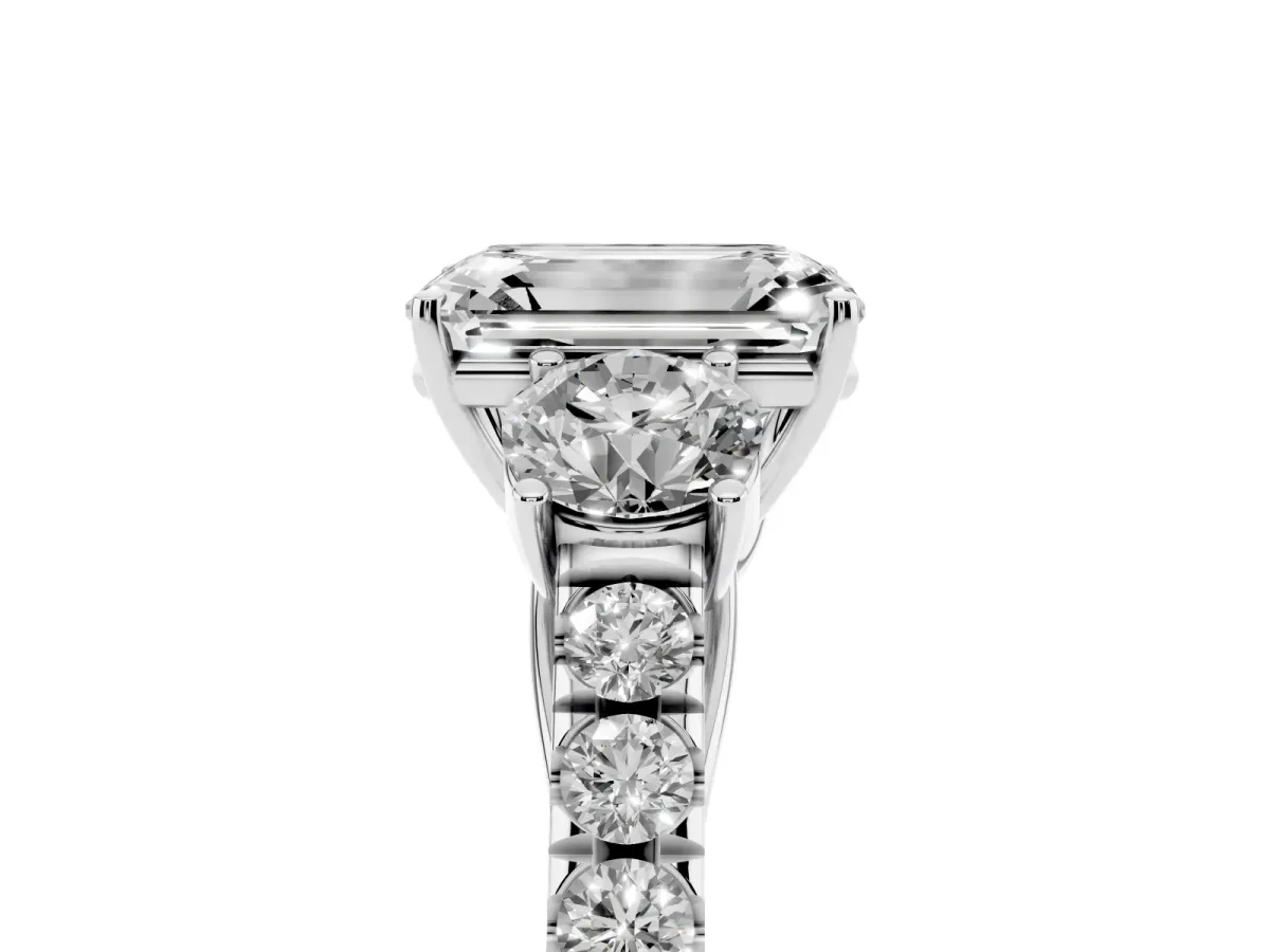 Emerald Cut Cut Diamond Three-Stone Ring with Round Side Stones and Pavé Band Platinum