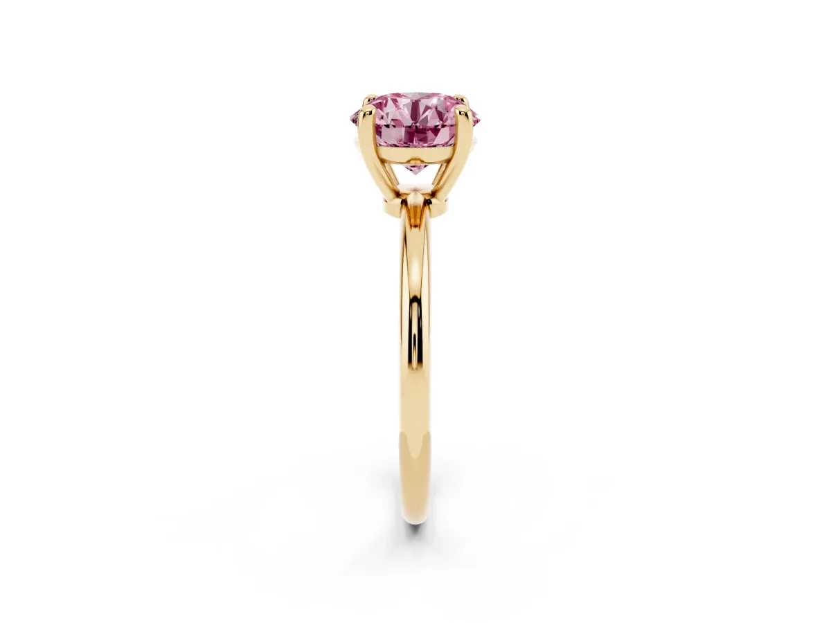 Fancy Pink Round Cut Solitaire Diamond Ring with 4-Prong Setting on a Classic Band Yellow gold