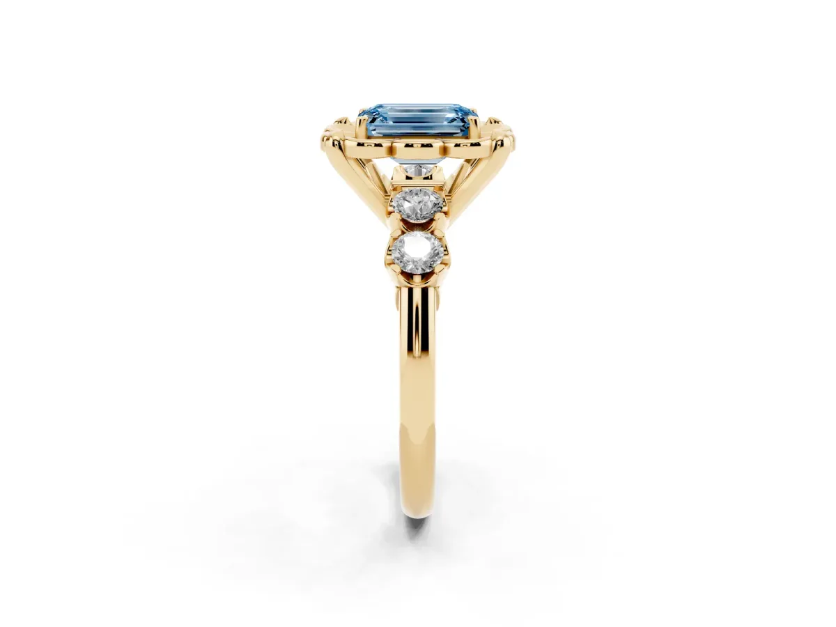 Fancy Blue Emerald Cut Cut Diamond Floral Halo Engagement Ring with Shared Prong Setting Yellow gold