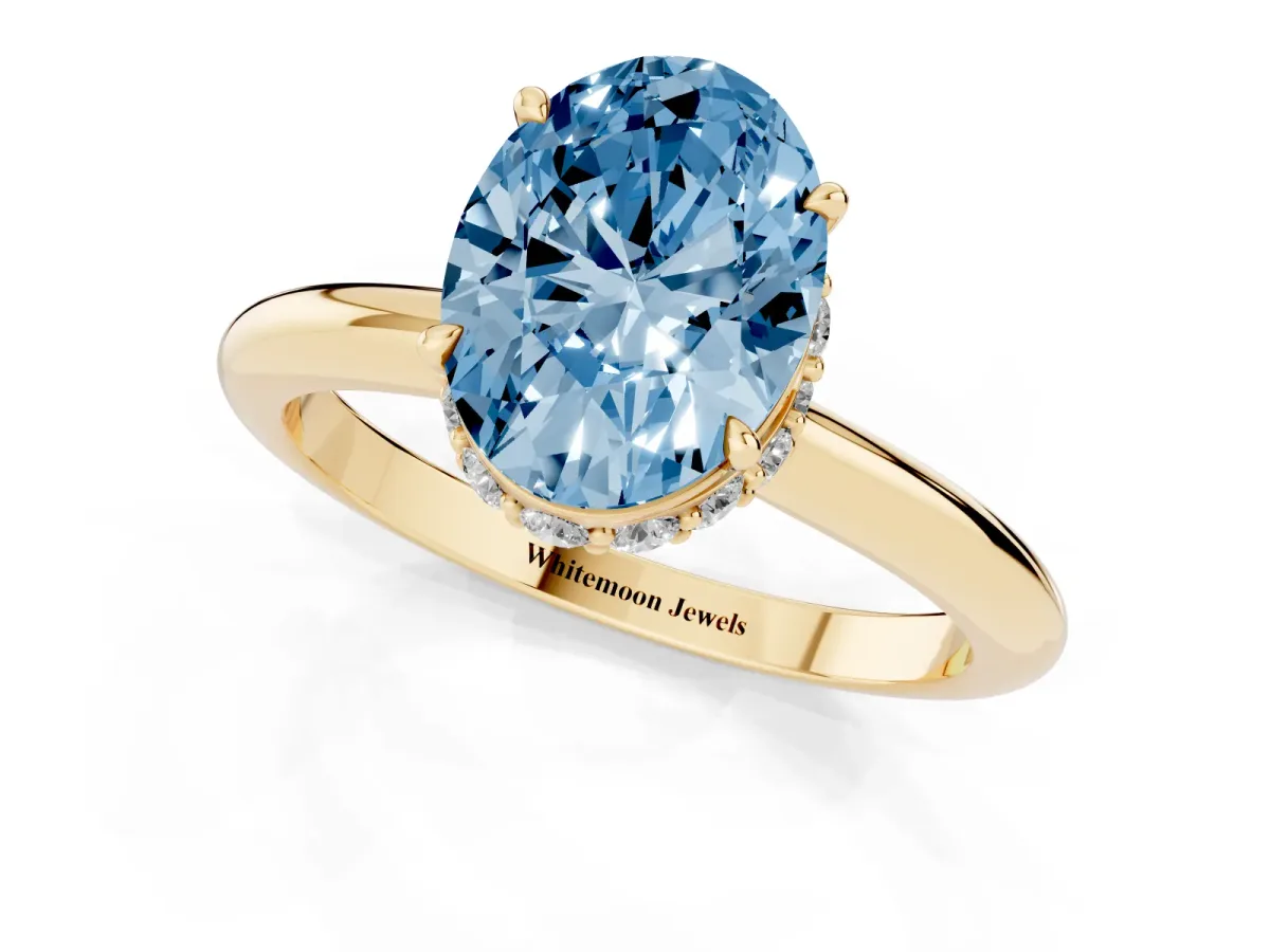 Fancy Blue Oval Cut Brilliant Solitaire Engagement Ring with Six-Prong Setting and Classic Band Yellow gold