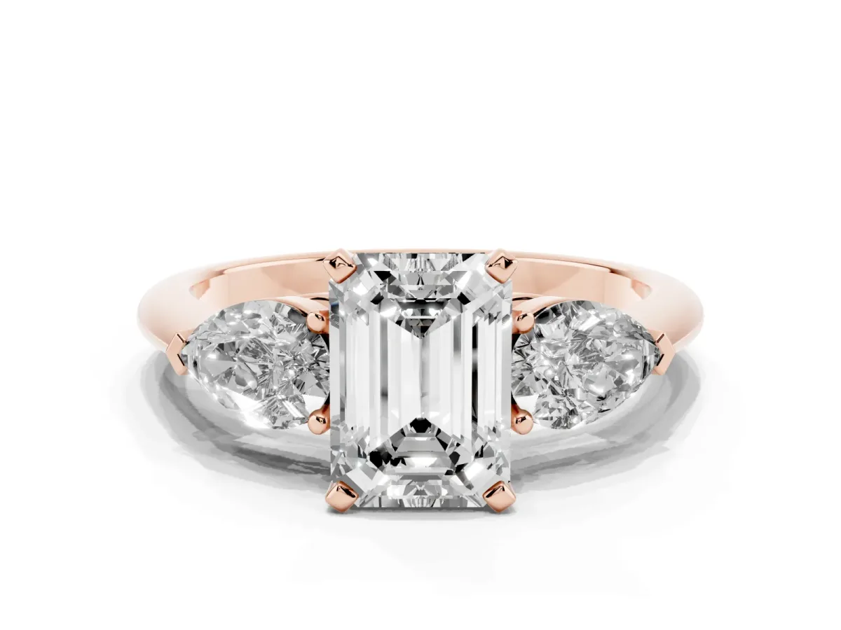 Three-Stone Emerald Cut Diamond Ring with Pear Side Stones and Four-Prong Setting Rose gold