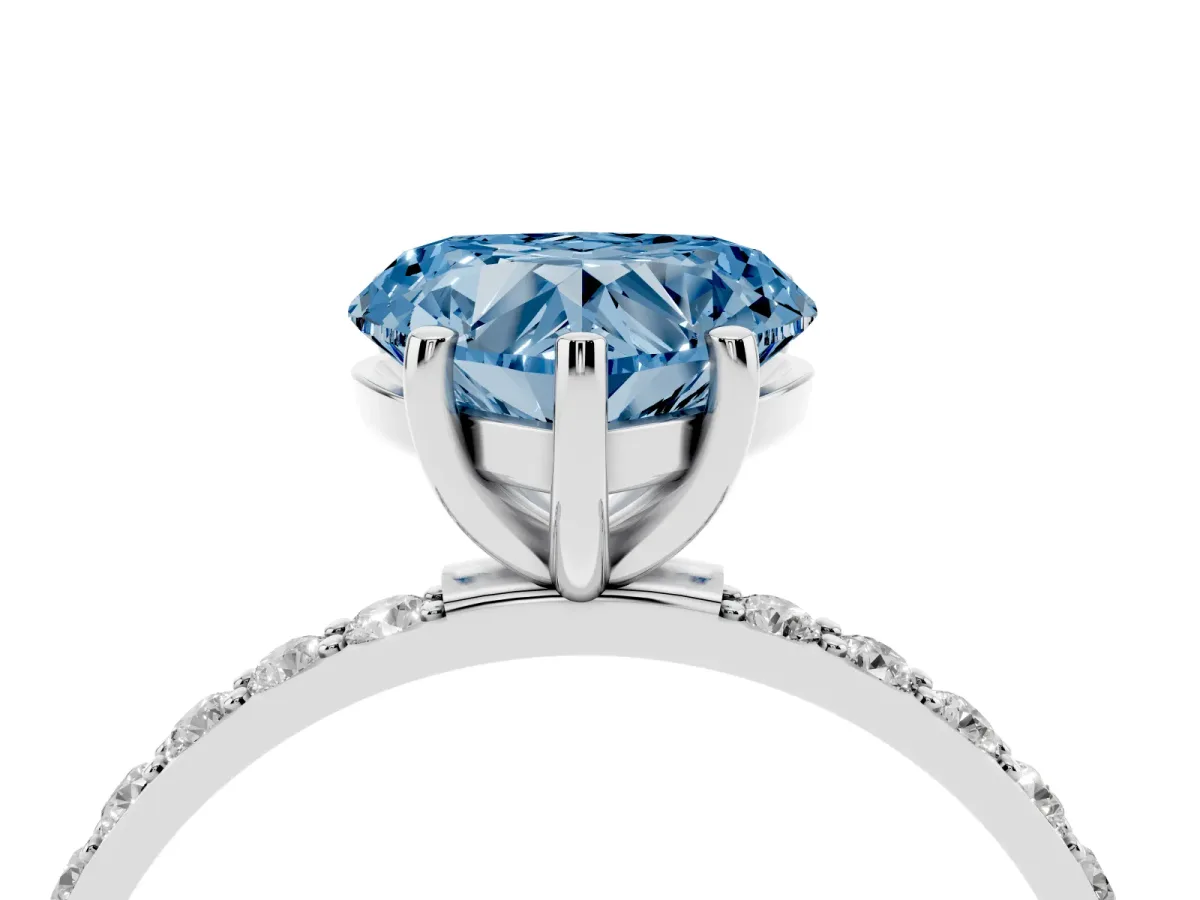 Fancy Blue Heart Cut Diamond Solitaire Ring with Round Pavé Shoulders and Prong Setting Silver
