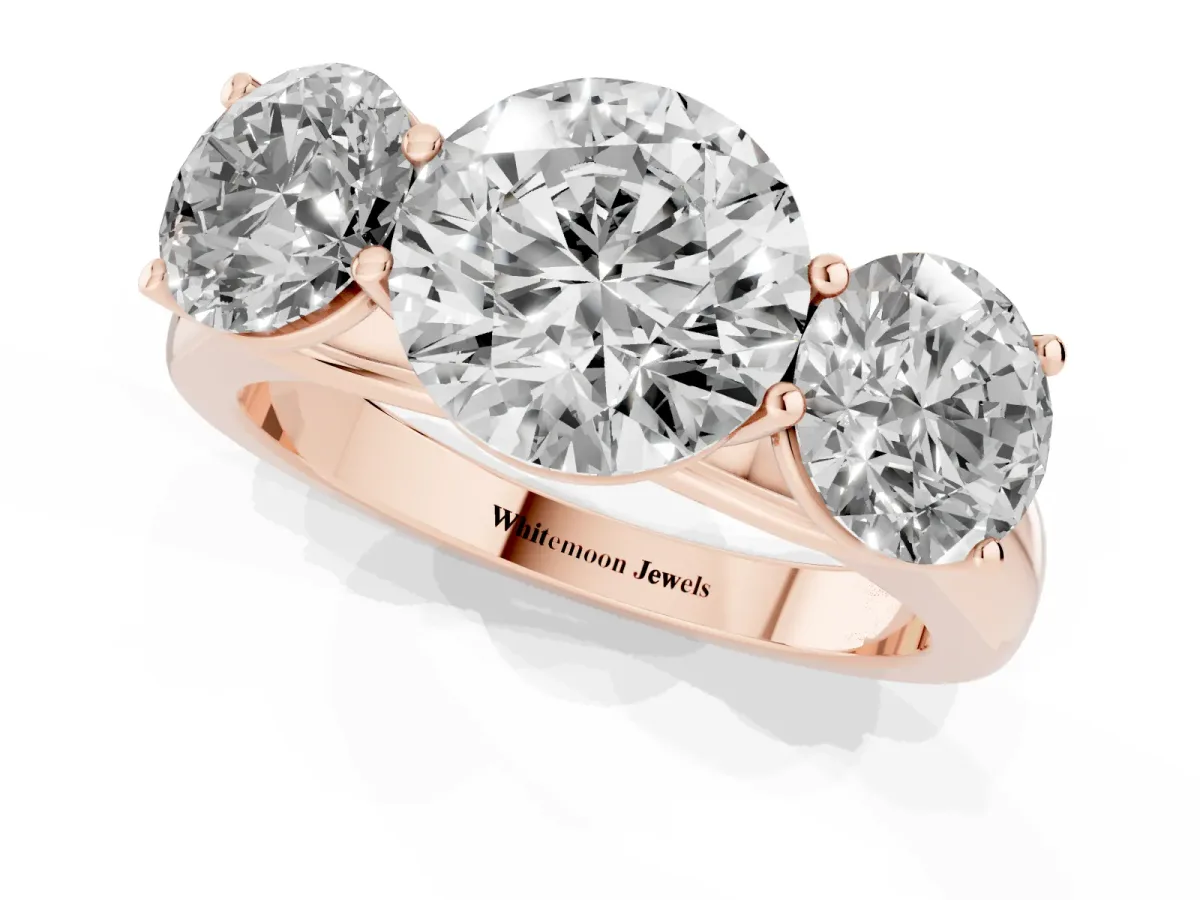 Round Cut Three-Stone Diamond Ring with Prong Setting on a Classic Band Rose gold