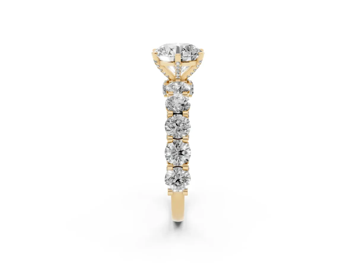 Round Cut Diamond Side Stone Engagement Ring with Four-Prong Setting Yellow gold