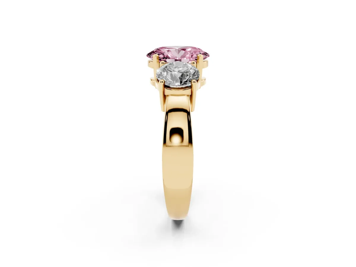 Fancy Pink Three-Stone Oval Cut Diamond Ring with Round Side Stones, Classic Band, and Four-Prong Setting Yellow gold