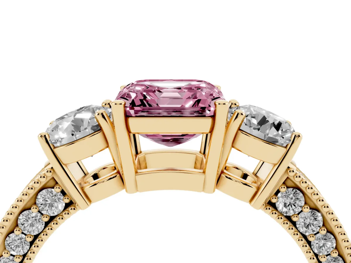 Fancy Pink Asscher Cut Three-Stone Diamond Ring with Pavé Band and Four-Prong Setting Yellow gold