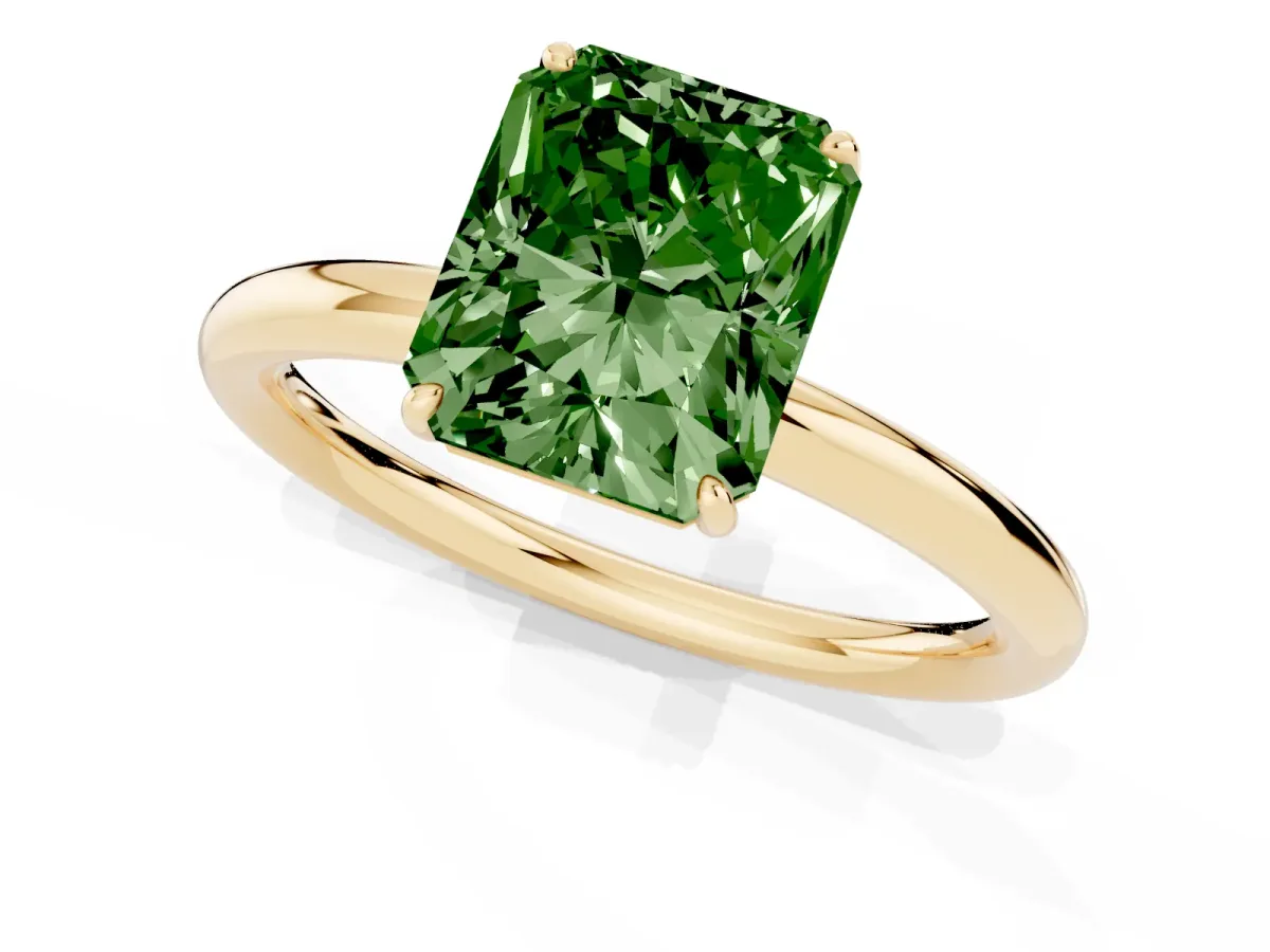 Fancy Green Radiant Cut Solitaire Diamond Ring with Four-Prong Setting on a Plain Band Yellow gold