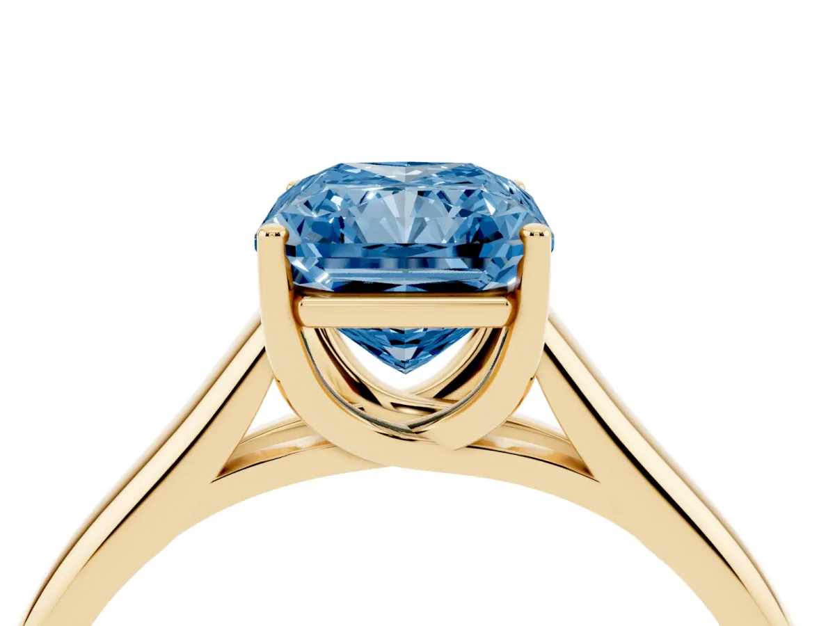 Fancy Blue Radiant Cut Solitaire Engagement Ring with Tapered Band and Four-Prong Setting Yellow gold