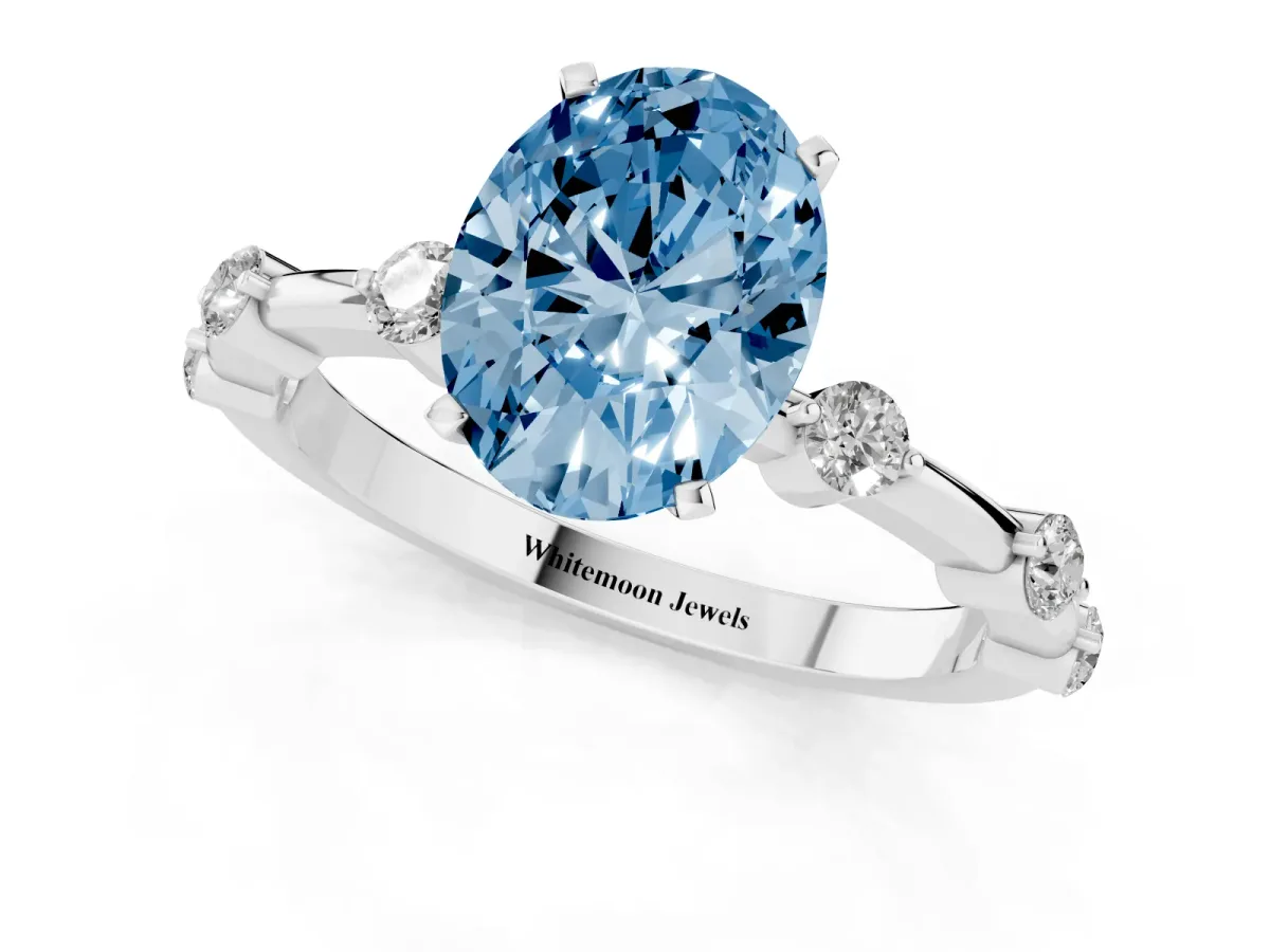 Fancy Blue Oval Cut Solitaire Diamond Ring with Bezel Set Side Stones and Prong Setting Silver