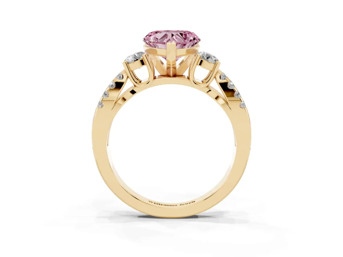 Fancy Pink Heart Cut Diamond Three-Stone Ring with Pavé Split Shank and Four-Prong Setting Yellow gold