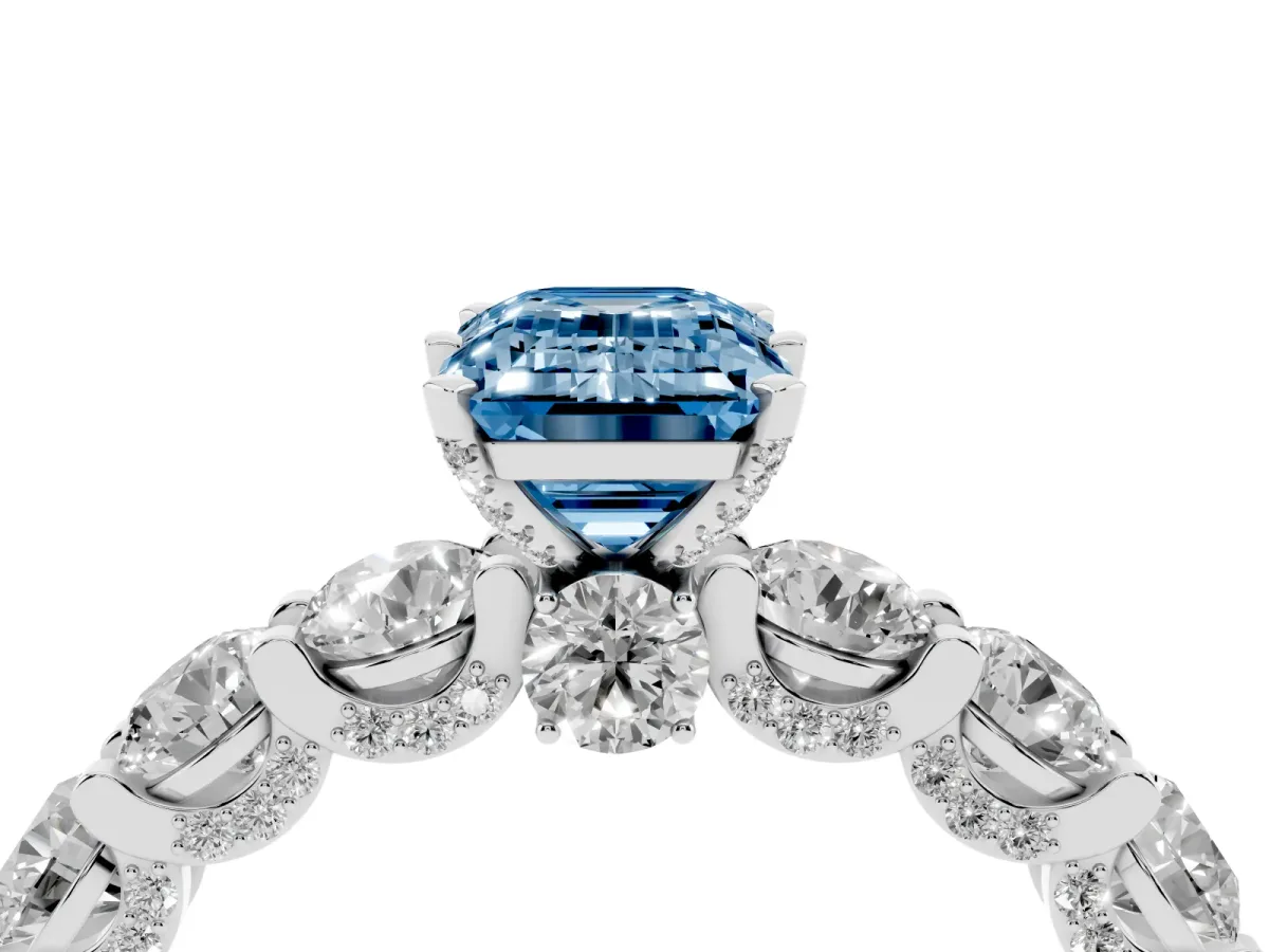 Fancy Blue Emerald Cut Diamond Side Stone Engagement Ring with Four-Prong Setting Silver