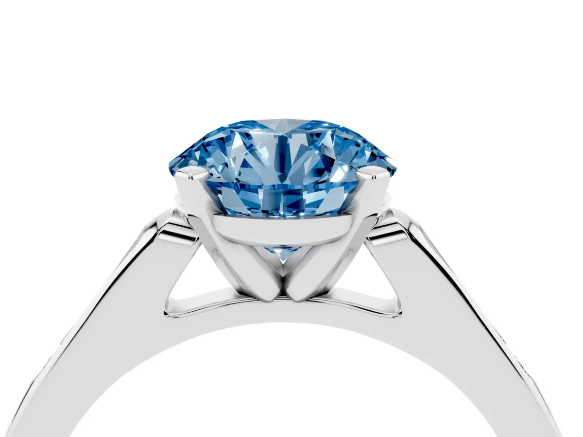 Fancy Blue Round Cut Diamond Solitaire Ring with Channel Set Round Band and Prong Setting Silver