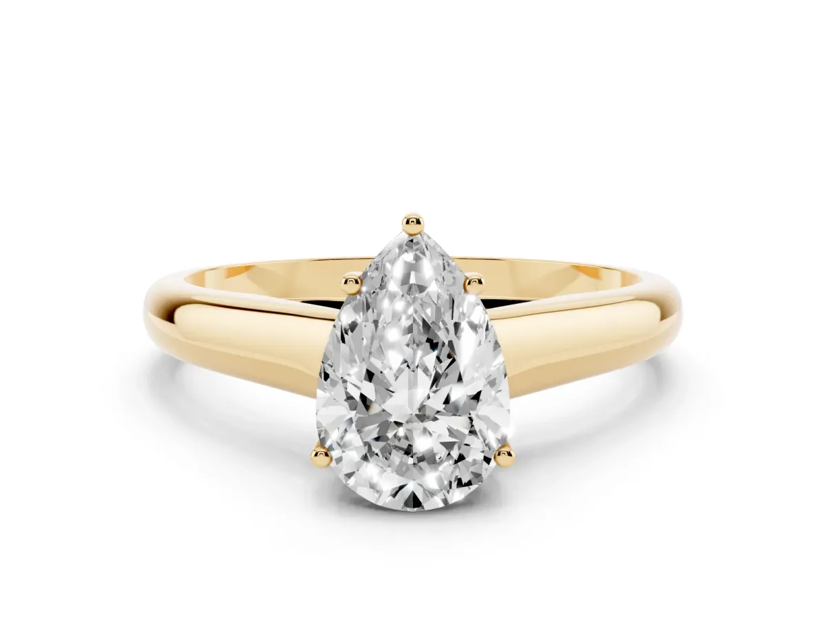 Pear Cut Solitaire Engagement Ring with Tapered Band and Four-Prong Setting Yellow gold