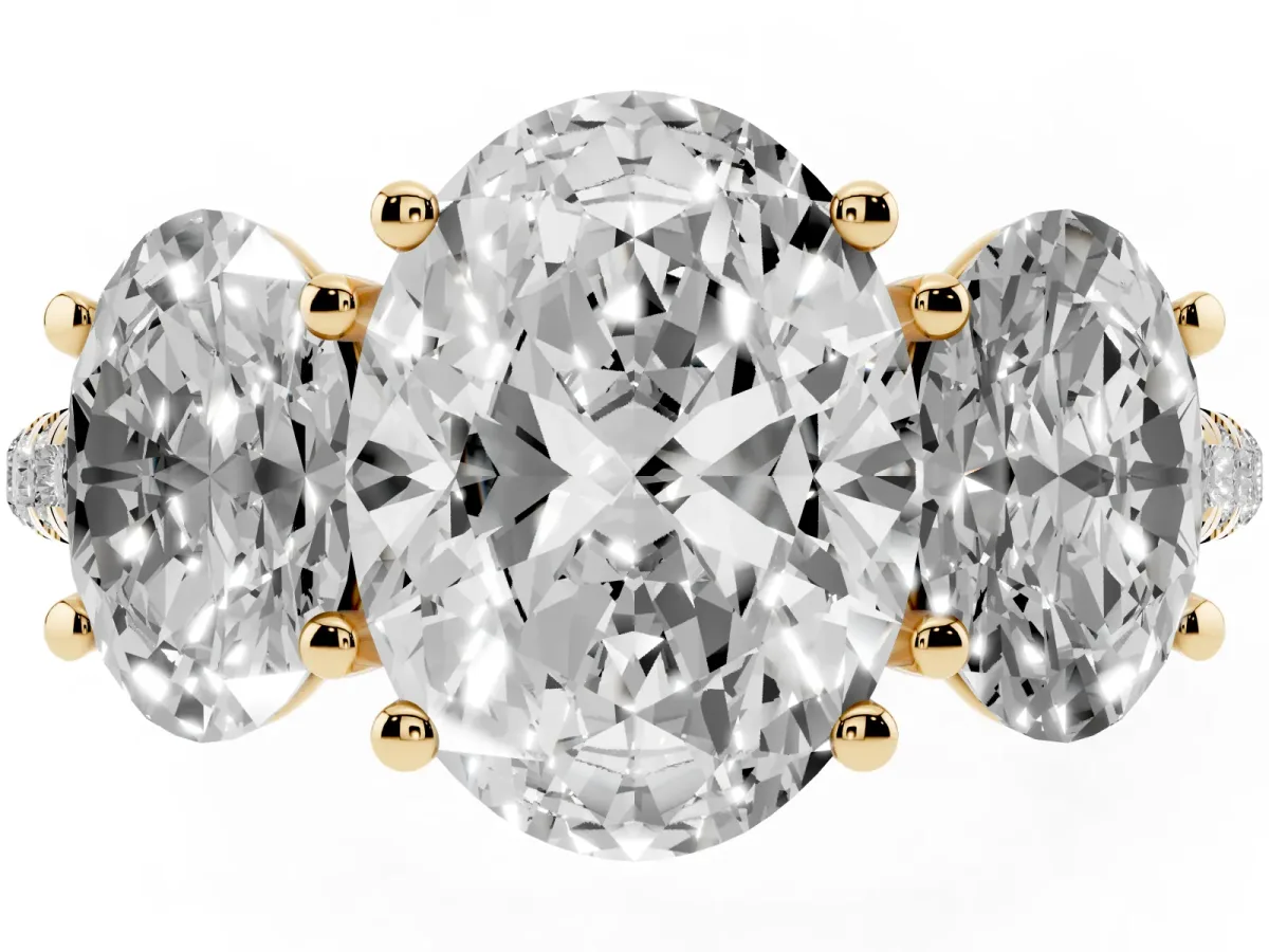 Three-Stone Oval Cut Diamond Ring with Round Pavé Band and Prong Setting Yellow gold