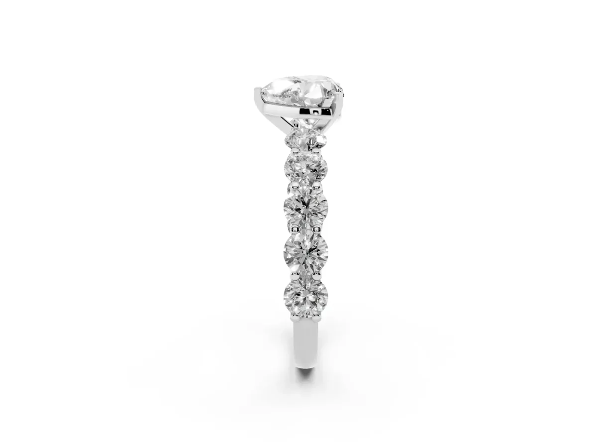 Heart Cut Diamond Prong Setting with Side Stones on a Pave Band Silver
