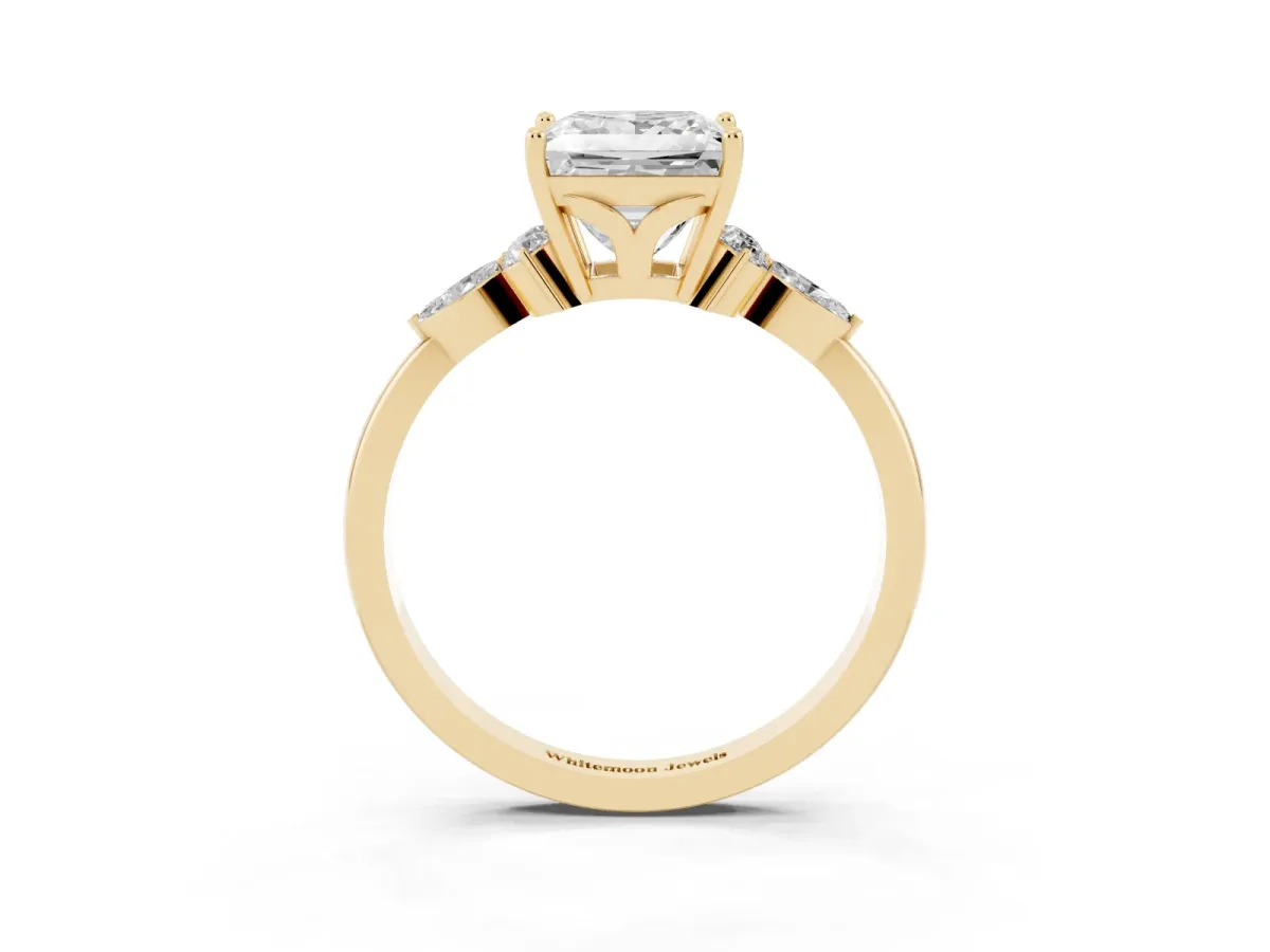 Princess Cut Brilliant Diamond Solitaire Ring with Pear Side Stones and Four-Prong Setting Yellow gold