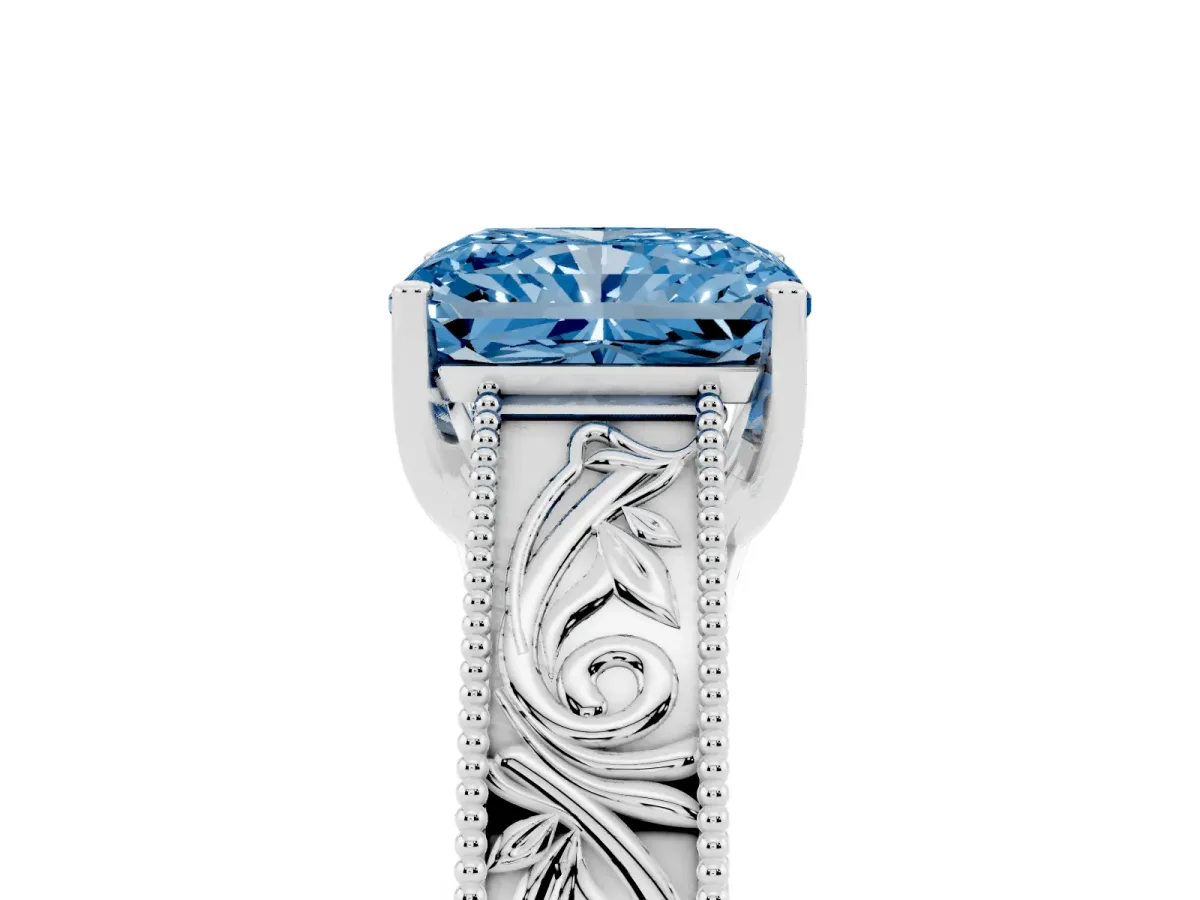 Fancy Blue Radiant Cut Diamond Solitaire Ring with Engraved Band and Four-Prong Setting White gold