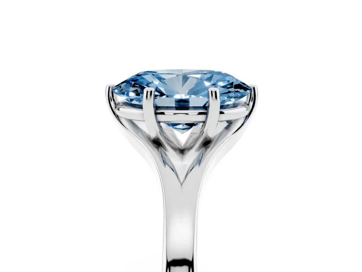 Fancy Blue Oval Cut Solitaire Diamond Ring with Six-Prong Setting and Tapered Band Silver