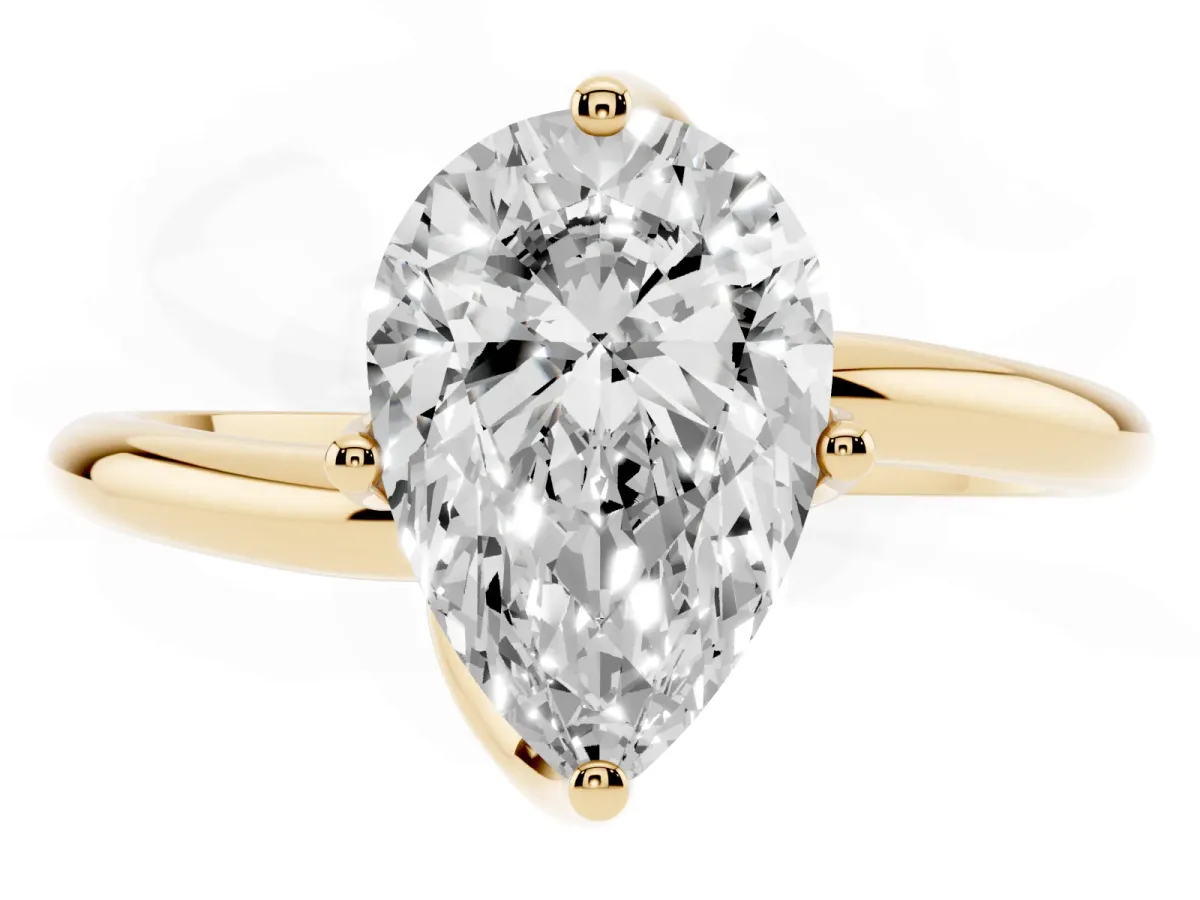 Pear Cut Diamond Solitaire Engagement Ring with Four-Prong Setting and Classic Band Yellow gold