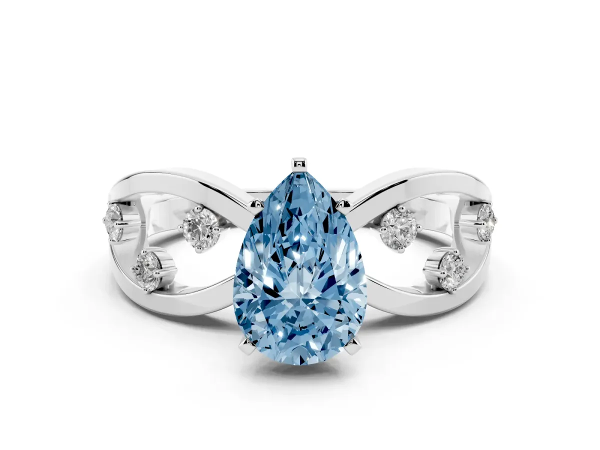 Fancy Blue Pear Cut Cut Solitaire Diamond with Side Stones on Criss-Cross Band and Four-Prong Setting Silver