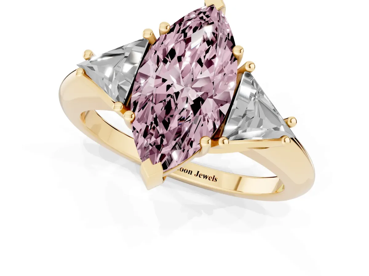 Fancy Pink Three-Stone Marquise Cut Diamond Engagement Ring with Trillion Side Stones and Prong Setting Yellow gold