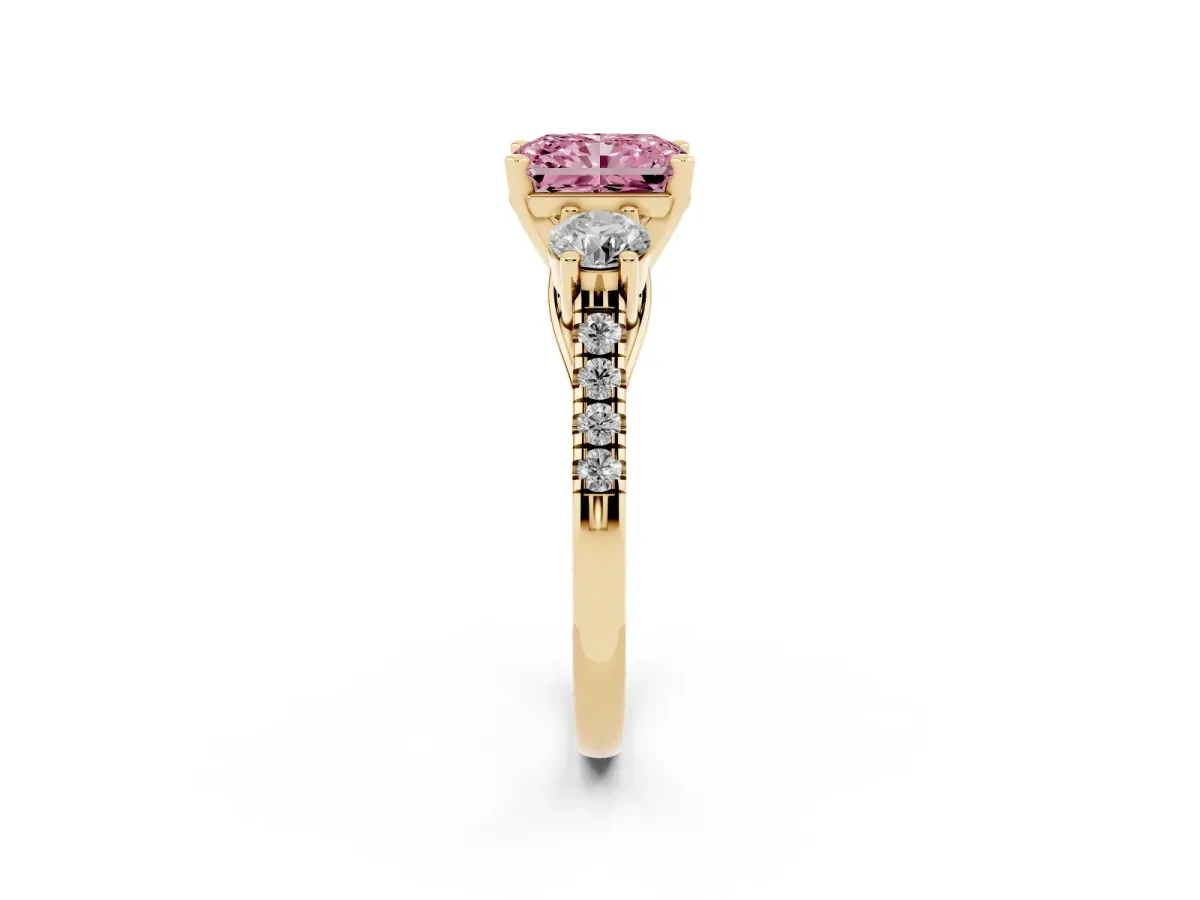 Fancy Pink Three-Stone Radiant Cut Diamond Pavé Band with Four-Prong Setting Yellow gold