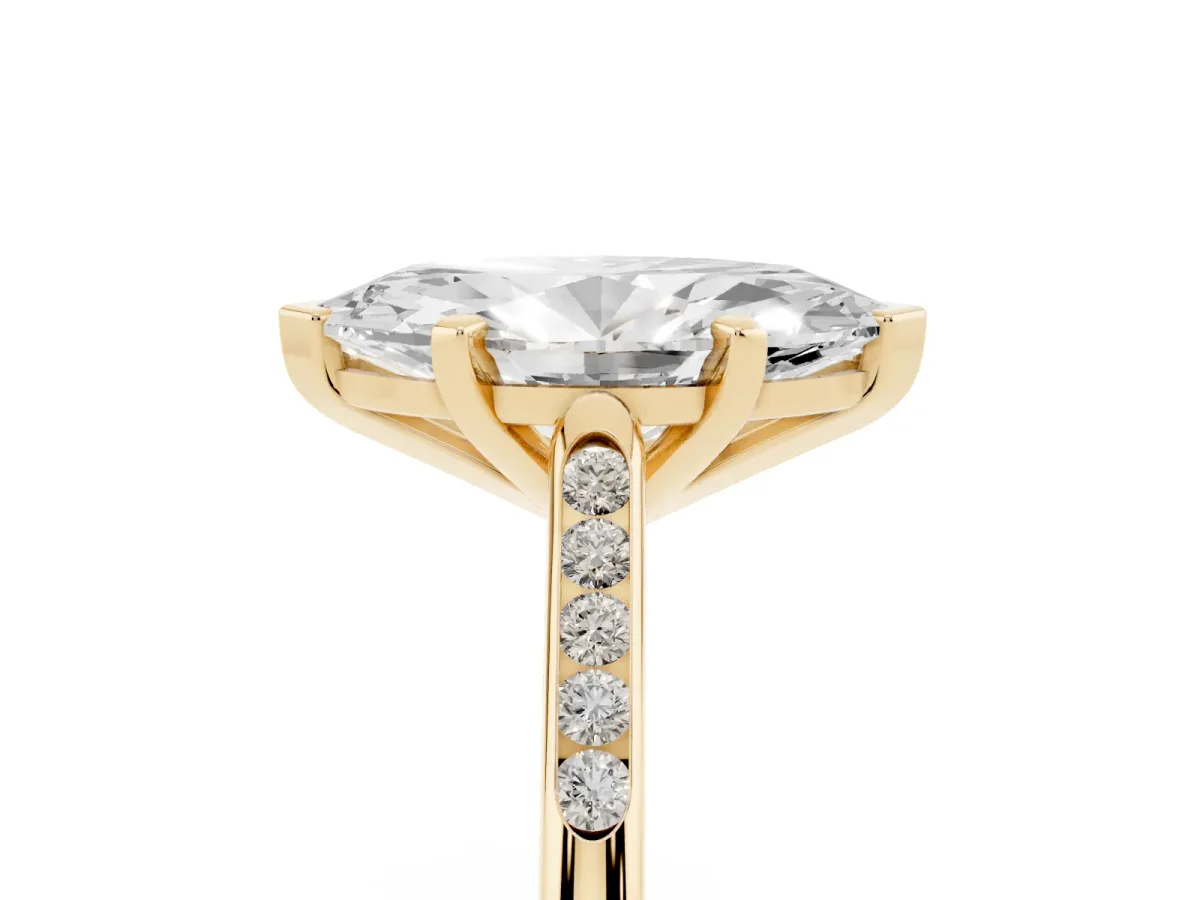 Marquise Cut Diamond Solitaire Ring with Channel Set Round Band and Prong Setting Yellow gold