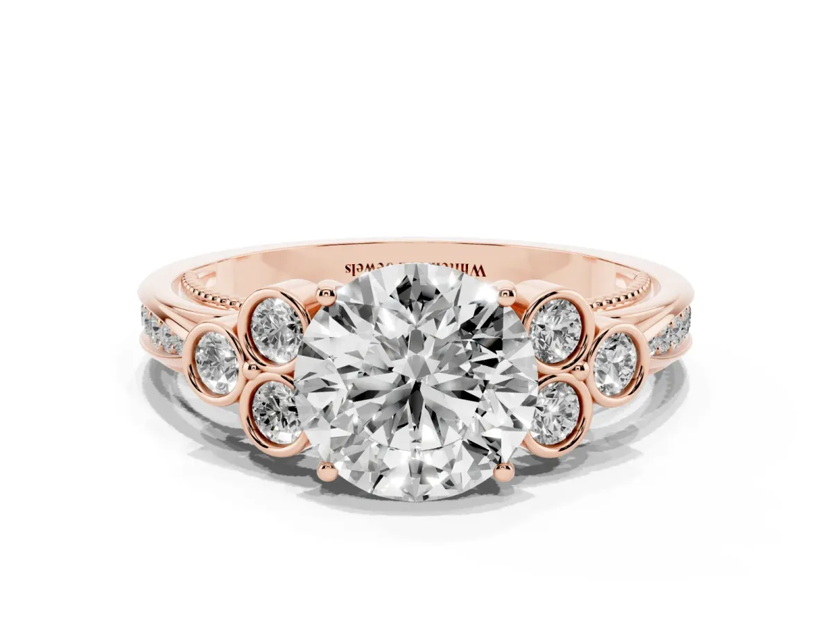 Round Cut Cut Diamond Engagement Ring with Bezel Set Round Side Stones and Prong Setting Rose gold