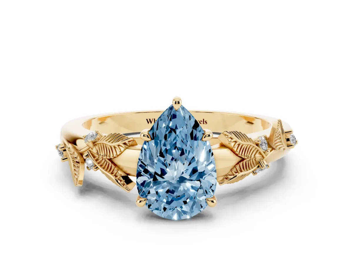 Fancy Blue Pear Cut Diamond Solitaire Ring with Leaf Motif Band and Four-Prong Setting Yellow gold