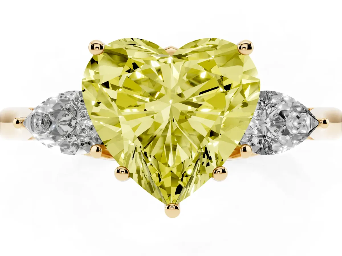 Fancy Yellow Three-Stone Heart Cut Brilliant Diamond Solitaire Ring with Tapered Band and Four-Prong Setting Yellow gold