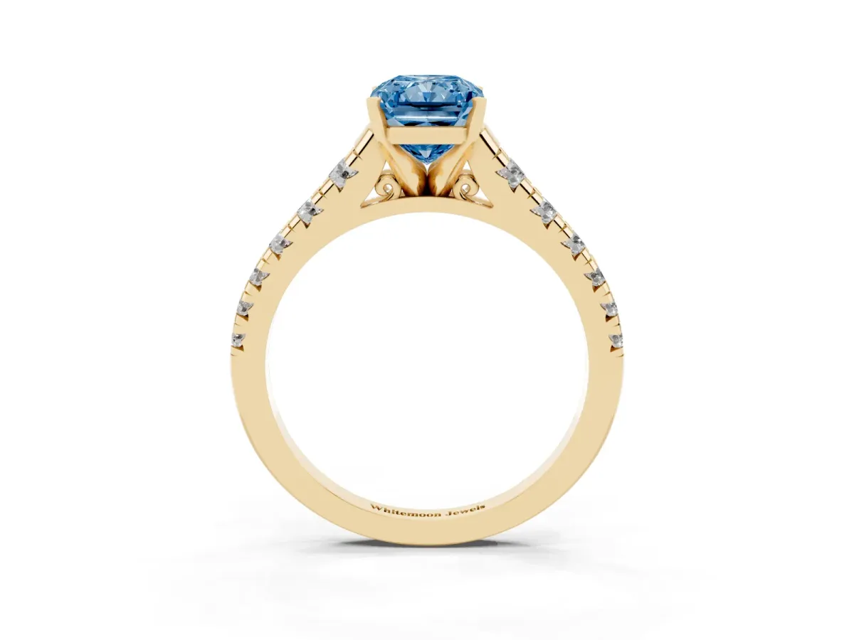 Fancy Blue Radiant Cut Diamond Cathedral Solitaire Ring with Round Pavé Band Yellow gold